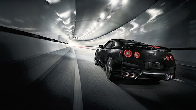 2023 Nissan GT-R seen from behind driving through a tunnel | Crossroads Nissan Wake Forest in Wake Forest NC